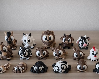May include: A collection of fifteen small, stylized animal figurines crafted with a smooth finish. The set includes various creatures such as a lion, cow, horse, spider, and bird, all featuring large, expressive eyes and a monochromatic color palette.