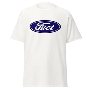May include: White t-shirt with a navy blue oval logo that says "Fuct" in a stylized font. The shirt is a short-sleeved, casual style.