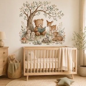 May include: A wall decal featuring a brown bear reading a book under a tree, surrounded by two rabbits, a fawn, and a small deer. The scene includes wildflowers, mushrooms, and a small bird on a tree stump, rendered in soft, muted watercolor tones.