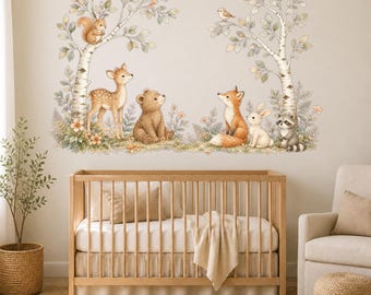 May include: A wall decal set featuring watercolor illustrations of woodland animals including a deer, bear, fox, rabbit, raccoon, and squirrel, positioned among birch trees, foliage, and small birds, rendered in soft earth tones and muted greens.