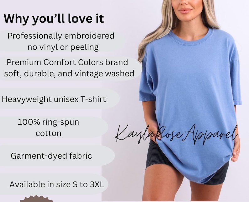 May include: A light blue, heavyweight unisex T-shirt. The shirt is garment-dyed and made of 100% ring-spun cotton. The text "Kayla Rose Apparel" is visible on the shirt. Available in sizes S to 3XL.