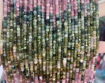 May include: A strand of multi-colored gemstone beads. The beads are small and square-shaped. The colors are pink, green, and brown.