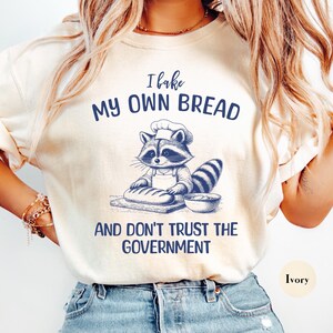 I Bake My Own Bread And Don&#39;t Trust The Government Comfort Colors® Shirt | Funny Anti-Government Sarcastic Meme Shirt | Funny Raccoon Shirt