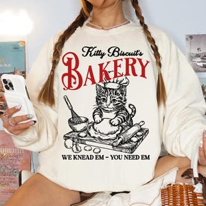 Funny Cat Biscuit Sweatshirt | Kitty Biscuits We Knead Em You Need Em Shirt | Retro Vintage Cat Shirt | Baker Cat Lover Shirt Sweatshirt
