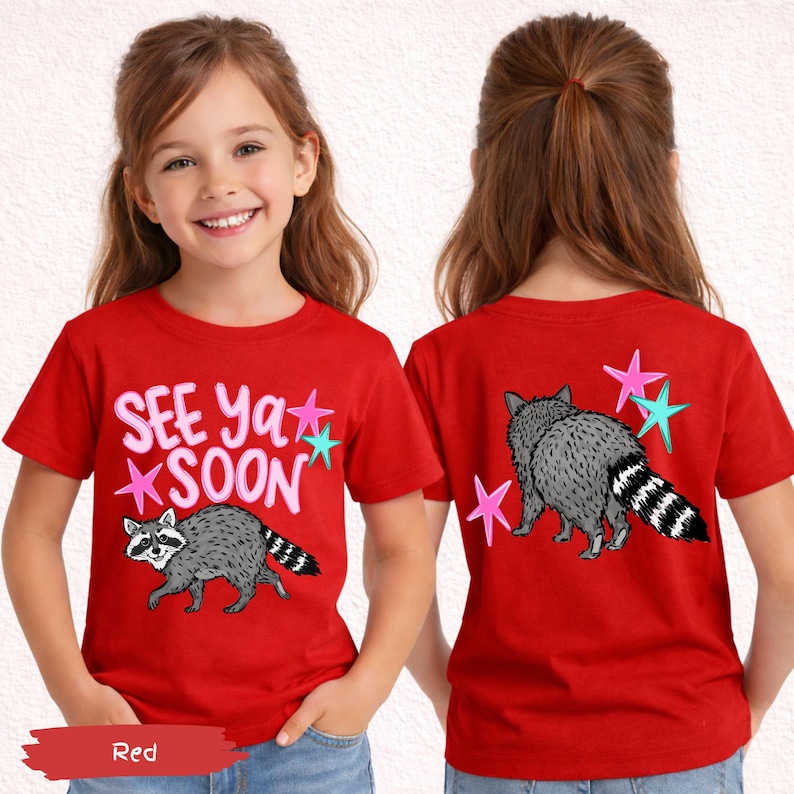 May include: Red t-shirt with a raccoon graphic and the text "SEE Ya SOON". The back of the shirt features a raccoon and star graphics. The shirt is made of a soft material.