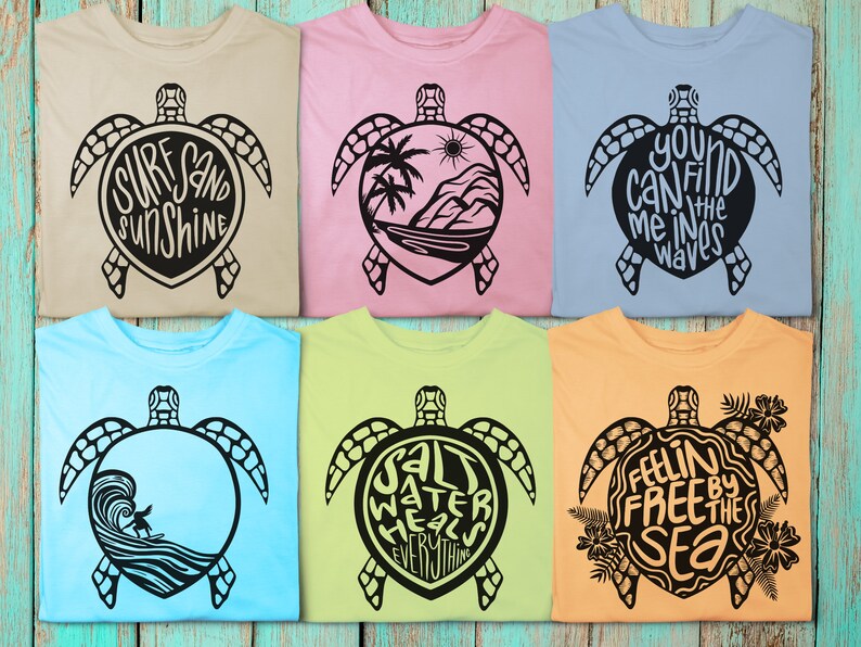 May include: Six different t-shirts with a sea turtle design and a phrase inside the turtle shell. The phrases are "Surf Sand Sunshine", "You Can Find Me In The Waves", "Salt Water Heals Everything", "Feelin Free By The Sea",  "Surf Sand Sunshine", and "You Can Find Me In The Waves".