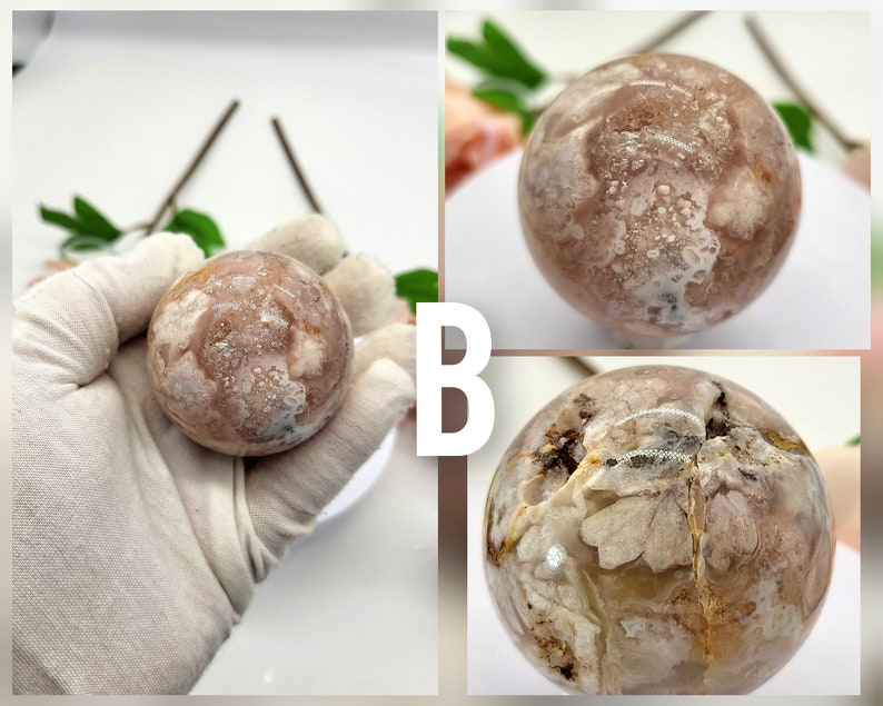 May include: A pink and white agate sphere with a unique, swirling pattern. The sphere is smooth and polished, and it has a natural, organic look.