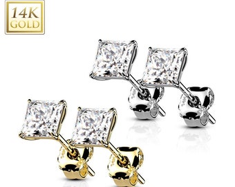 May include: A pair of 14K gold square stud earrings with clear cubic zirconia stones. The earrings have a post and butterfly back closure.
