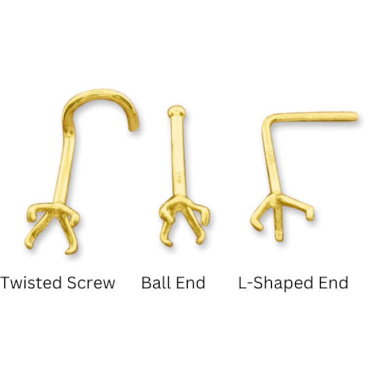 May include: Three gold nose rings with different end styles: twisted screw, ball end, and L-shaped end.
