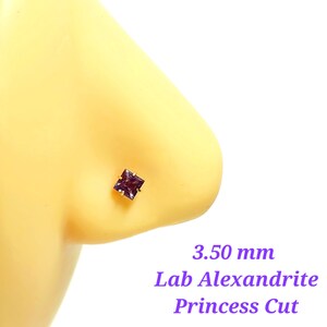 May include: A purple lab-created alexandrite gemstone nose stud with a princess cut. The stud is 3.50 mm in size and is set in gold.