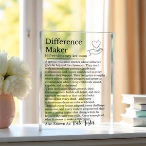 May include: A clear glass plaque with the words "Difference Maker" and a definition, along with a description of a special education teacher's impact. The plaque includes the name "Kate Foster" at the bottom.