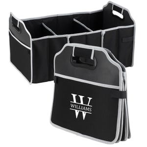 May include: A black and gray foldable car organizer with a white monogram that says "W WILLIAMS".