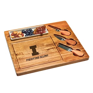 May include: A wooden cheese board with a white ceramic dish, four cheese knives, and the University of Illinois Fighting Illini logo. The board is made of acacia wood and has a natural finish.