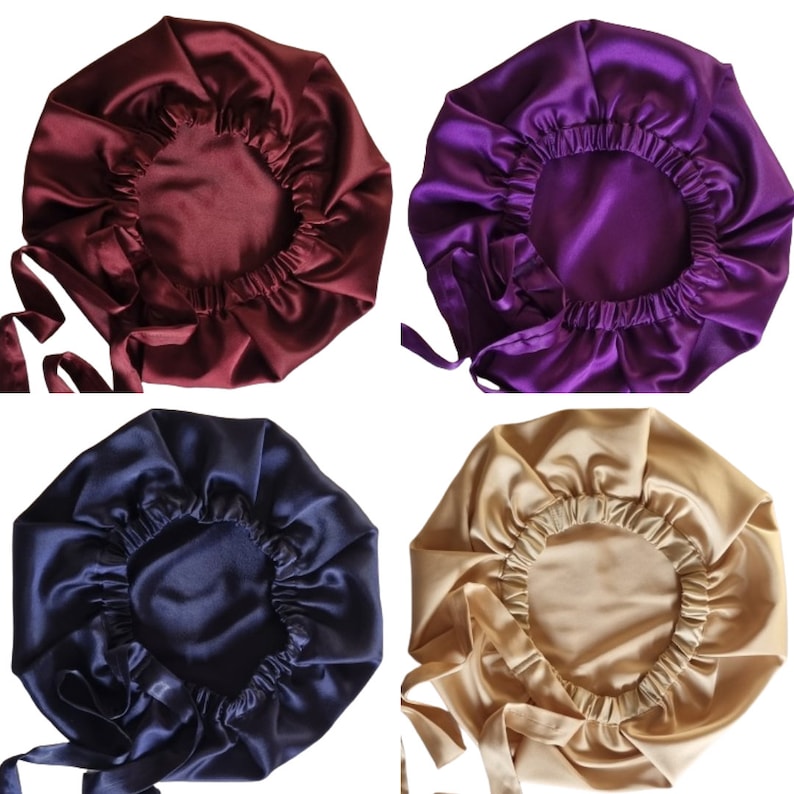 May include: Four satin bonnets in different colors: burgundy, purple, navy blue, and gold. Each bonnet has a gathered elastic edge and long ties for securing. The bonnets are designed to protect hair while sleeping.