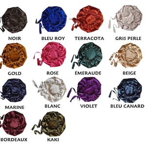 May include: A collection of satin bonnets in various colors, including black, blue, terracotta, and gold. Each bonnet has a drawstring tie. The image also includes the color names: Noir, Bleu Roy, Terracota, Gris Perle, Gold, Rose, &Eacute;meraude, Beige, Marine, Blanc, Violet, Bleu Canard, Bordeaux, and Kaki.