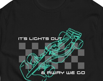 May include: Black t-shirt with a neon green outline of a race car and the text "IT'S LIGHTS OUT & AWAY WE GO" in white. The design includes a checkered flag pattern. The shirt is a short-sleeved crew neck.