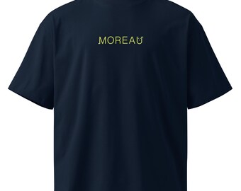 May include: Navy blue short-sleeve t-shirt with a mock neck. The word "MOREAU" is printed in a yellow, stylized font across the chest. The shirt has a relaxed fit and a simple, minimalist design.
