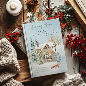May include: A blue and white book with a watercolour illustration of a snowy cottage and a fox. The book title is "Morning Menu" and the text on the bottom reads "For the Lord is good, His steadfast love endures forever, and His faithfulness is to all generations."