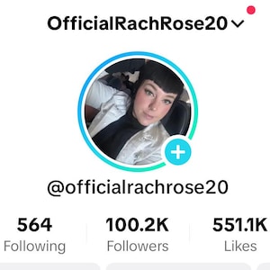 May include: A profile picture of a woman with dark hair and dark eyes. She is wearing a white jacket over a black shirt. The profile picture is on a social media platform with the username @officialrachrose20. The profile has 564 people following, 100.2K followers, and 551.1K likes.