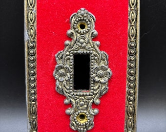 Velvet and metal light switch cover