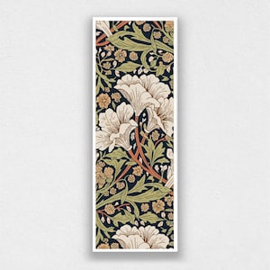 May include: A rectangular print featuring a floral pattern with cream-colored flowers, green leaves, and small yellow blossoms against a dark blue background. The design has a vintage aesthetic.