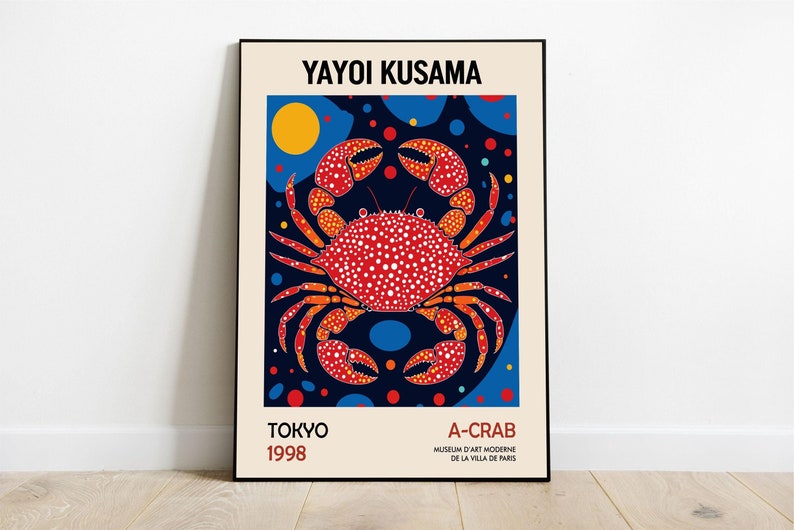 May include: A poster featuring a red and orange crab with white polka dots on a dark blue background with yellow, blue, and red circles. The text "YAYOI KUSAMA" is at the top of the poster, and the text "TOKYO 1998" is at the bottom left. The text "A-CRAB MUSEUM D'ART MODERNE DE LA VILLA DE PARIS" is at the bottom right.