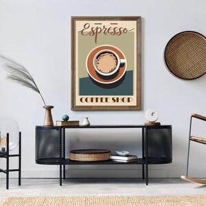 May include: A vintage-style poster with a brown wooden frame featuring a cup of espresso with the text "Espresso Coffee Shop" in a retro font.