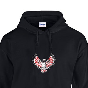 May include: Black hooded sweatshirt with a red and white stylized eagle design on the front.