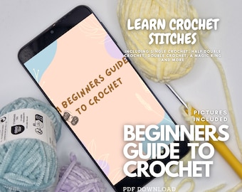 Könnte beinhalten: Ein Smartphone zeigt eine rosa-blaue Grafik mit dem Text "Anfänger-Guide zum Häkeln" und den Worten "Häkelmaschen lernen" über einem gelben Häkelnadel und Garn. Der Text unter dem Bild lautet "Anfänger-Guide zum Häkeln" und "PDF-Download".