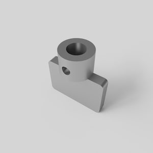 May include: A white ceramic mug with a black handle and the text "But First, Coffee" in a bold, black font. The mug is set against a blurred background, suggesting a cozy setting.