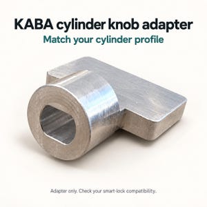 May include: A silver-colored metal KABA cylinder knob adapter with a cylindrical base and a flat, rectangular extension. The text KABA cylinder knob adapter, Match your cylinder profile, and Adapter only. Check your smart-lock compatibility. is visible.
