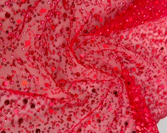 May include: Red sequined fabric with a mesh backing. The sequins are small and evenly distributed across the fabric.