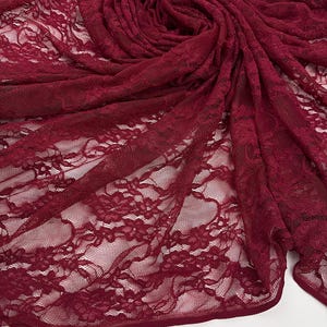Wine red floral stretch lace for boudoir intimates and evening gown overlays. 60-inch wide premium nylon spandex mesh fabric.