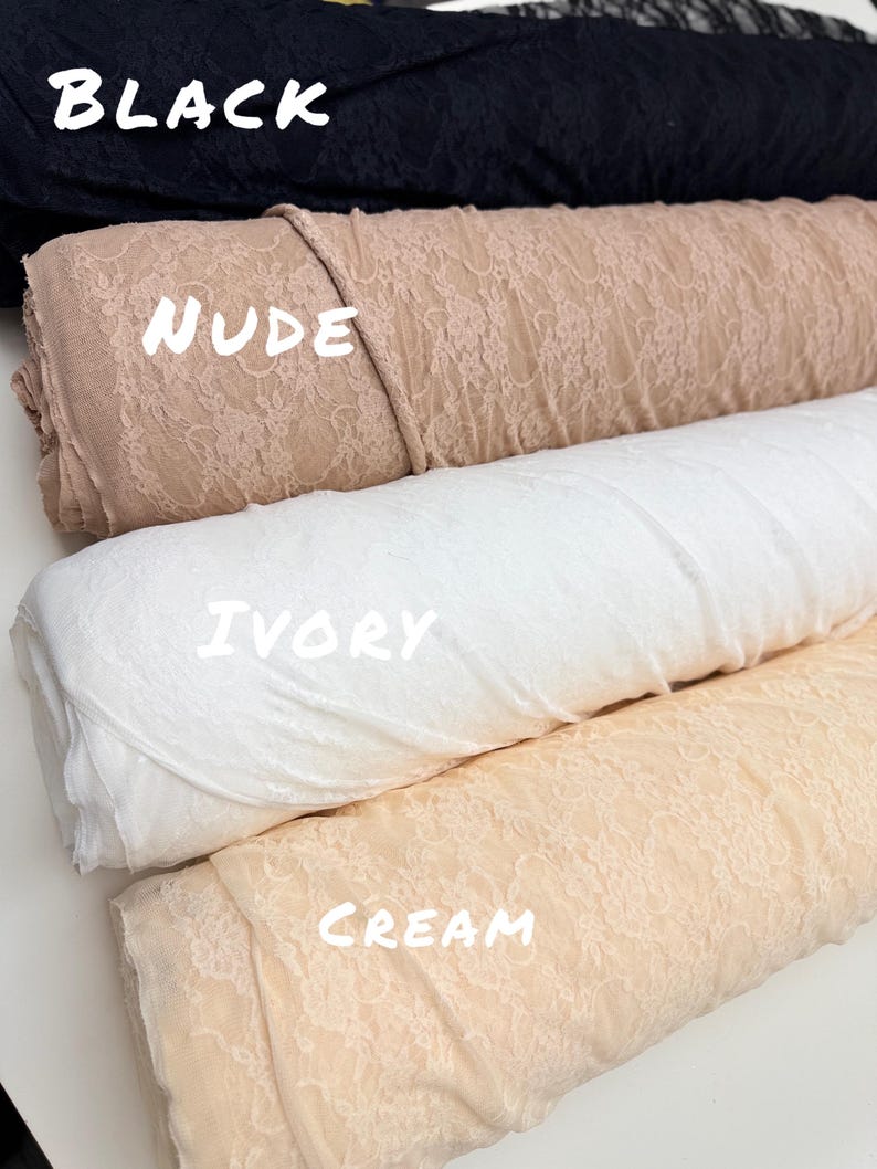 May include: Close-up of four rolls of lace fabric in various colors. The colors include black, nude, ivory, and cream. The word "BLACK" is written in white across the top roll. The word "NUDE" is written in white across the second roll. The word "IVORY" is written in white across the third roll. The word "CREAM" is written in white across the bottom roll.