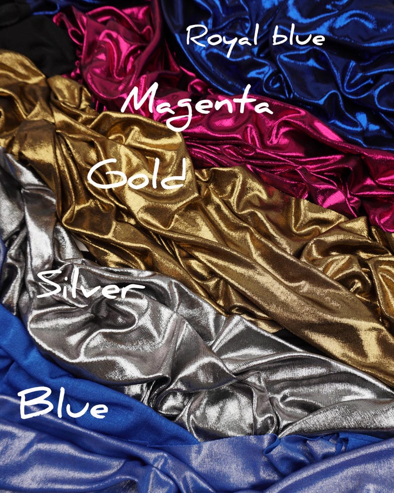 May include: A collection of metallic fabric swatches in various colours including royal blue, magenta, gold, silver, and blue. Each section of fabric features a shiny, reflective surface with draped folds and handwritten labels identifying each colour.