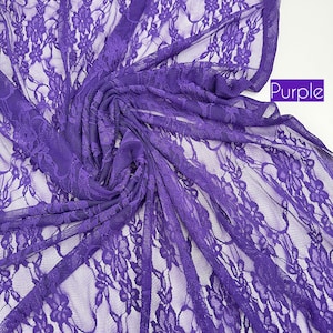 May include: A close-up of a vibrant purple lace fabric. The fabric is intricately patterned with floral designs and is gathered in soft folds. The word "Purple" is displayed in a white box in the upper right corner.