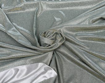 May include: Silver and gray shimmery fabric with a subtle sheen. The fabric is folded and draped to show its texture.