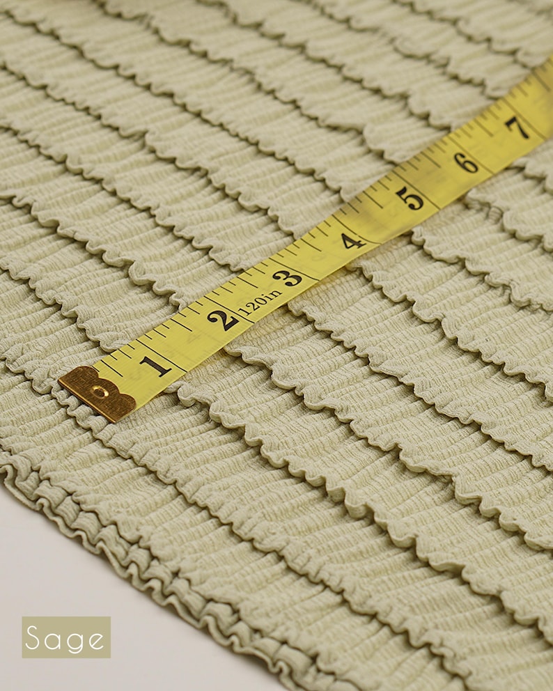 Sage green ruffle knit stretch fabric. Soft pre-smocked poly spandex yardage for bralettes, intimates, and boutique clothing.