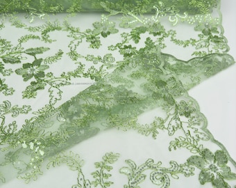 Saliegroene gebloemde kantstof op maat gesneden, geborduurd met koord met pailletten Stof Niet-rekbare lovertjes geborduurd op kant Bruidstrouwjurken