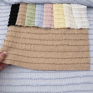 Taupe neutral shirred stretch yardage. High-quality poly spandex blend showing rich textured gathers and continuous cut length.