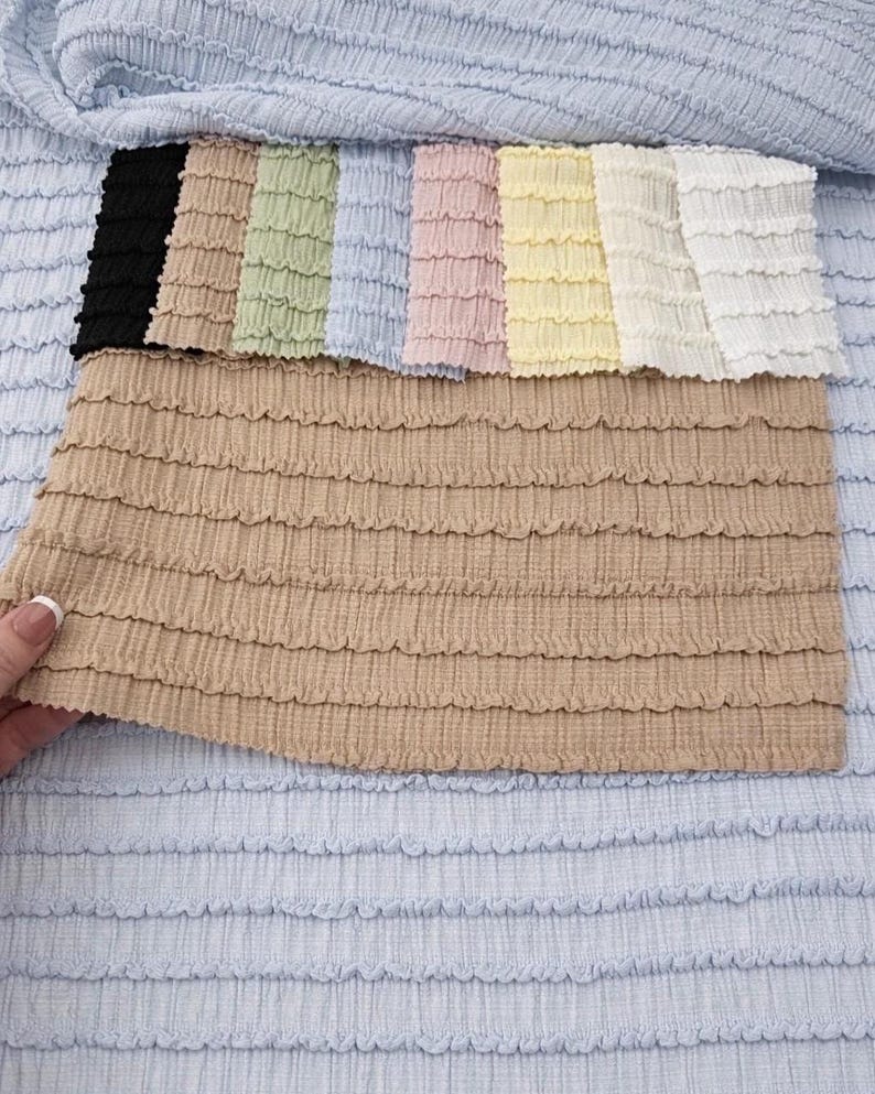 Taupe neutral shirred stretch yardage. High-quality poly spandex blend showing rich textured gathers and continuous cut length.