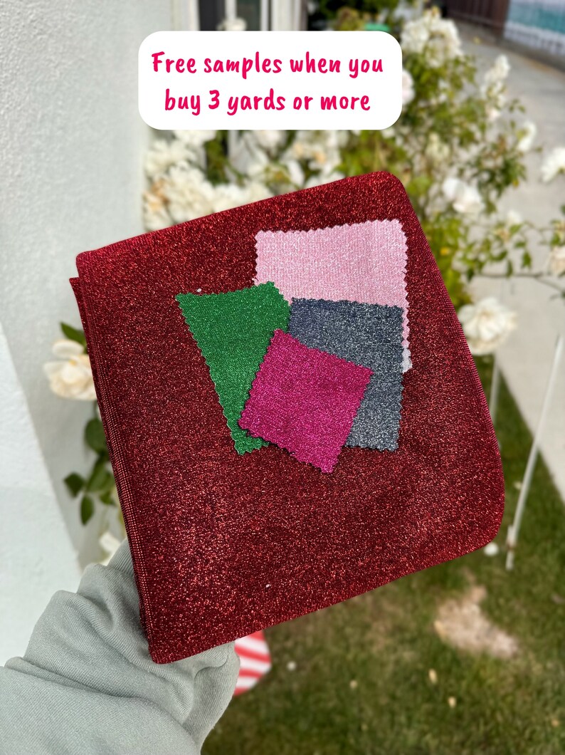 May include: Red, pink, green, and dark gray fabric swatches on a red sparkly fabric. The text "Free samples when you buy 3 yards or more" is written in white on a pink background.