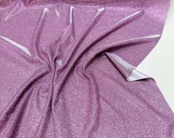 Tecido de malha lurex rosa brilhante, ideal para vestidos de noiva com efeito cintilante e elasticidade bidirecional.