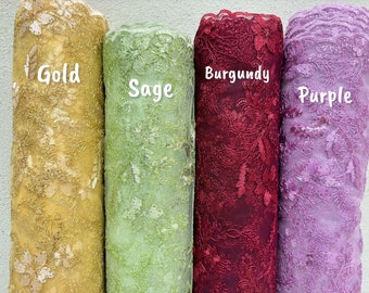 May include: Four rolls of embroidered lace fabric in gold, sage green, burgundy, and purple. Each roll is labeled with its color name in white text. The lace features floral and leaf patterns, suitable for various craft projects.