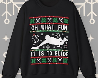May include: Black Christmas sweater with a white baseball player sliding into home plate. The sweater has a red and green pattern with the text "Oh What Fun It Is To Slide".