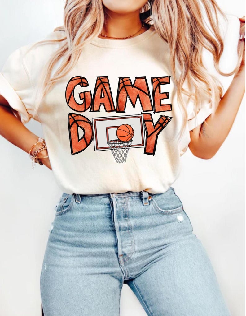 cute basketball shirt featuring a game day graphic made with basketball doodle font for a one of a kind piece