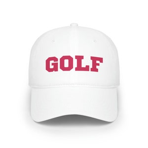 May include: White baseball cap with a red "GOLF" embroidered on the front.