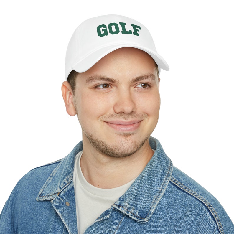 May include: A white baseball cap with a green "GOLF" embroidered on the front.