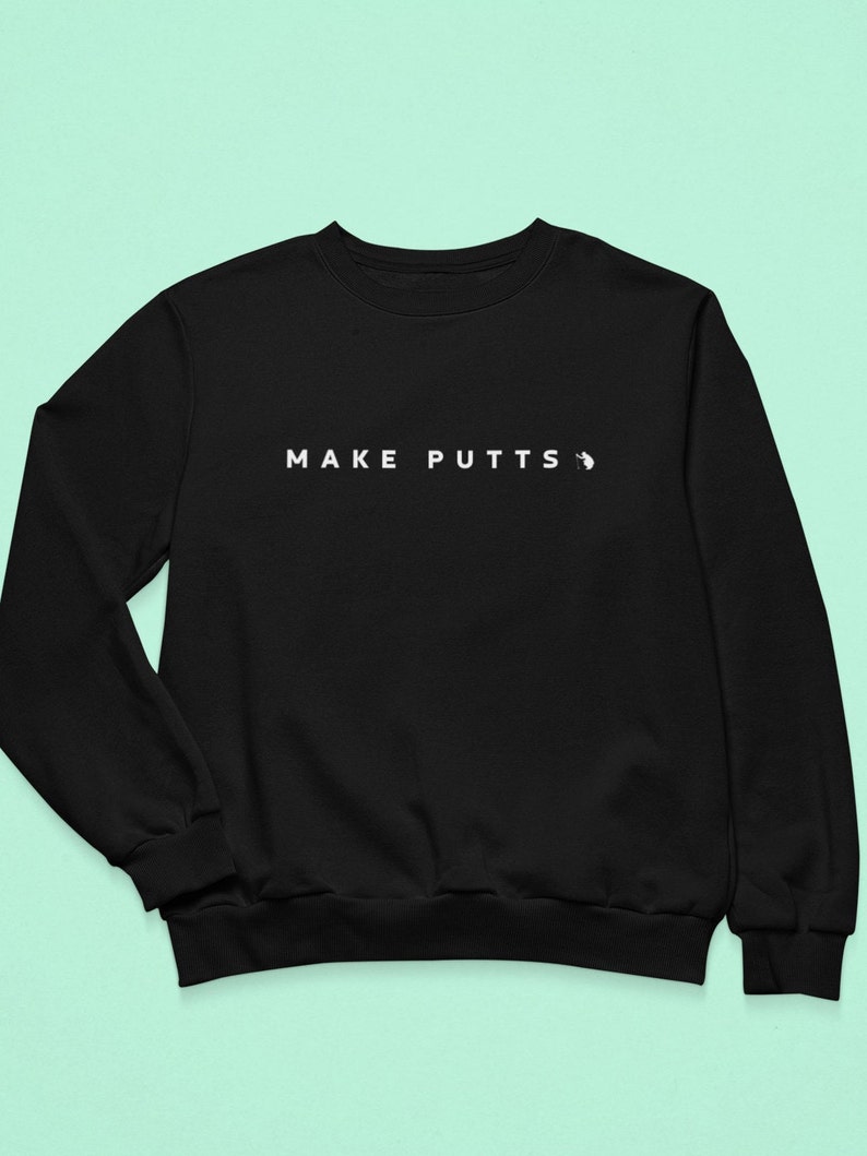 May include: Black sweatshirt with the text "MAKE PUTTS" in white.