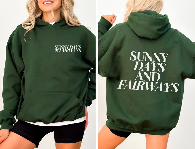 forest green golf themed hoodie with sunny days and fairways in a bold, trendy font on the back of the shirt. On the front, is a small sunny days and fairways graphic on the left chest